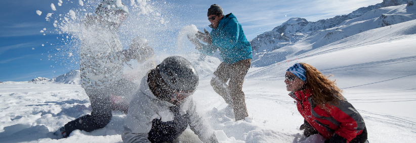A family playing in the snow in the French Alps